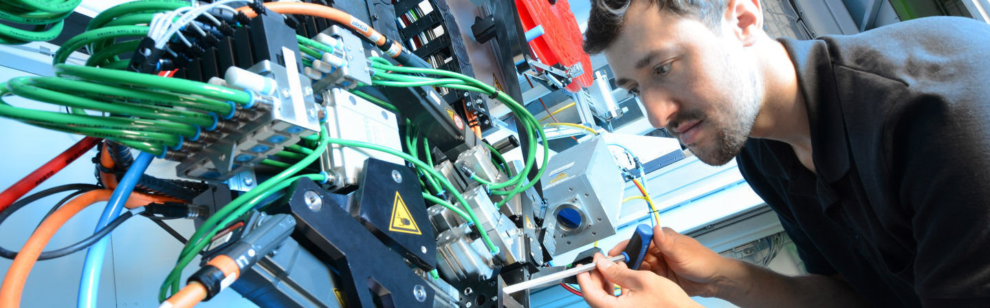 Scientist works on a tape laying head