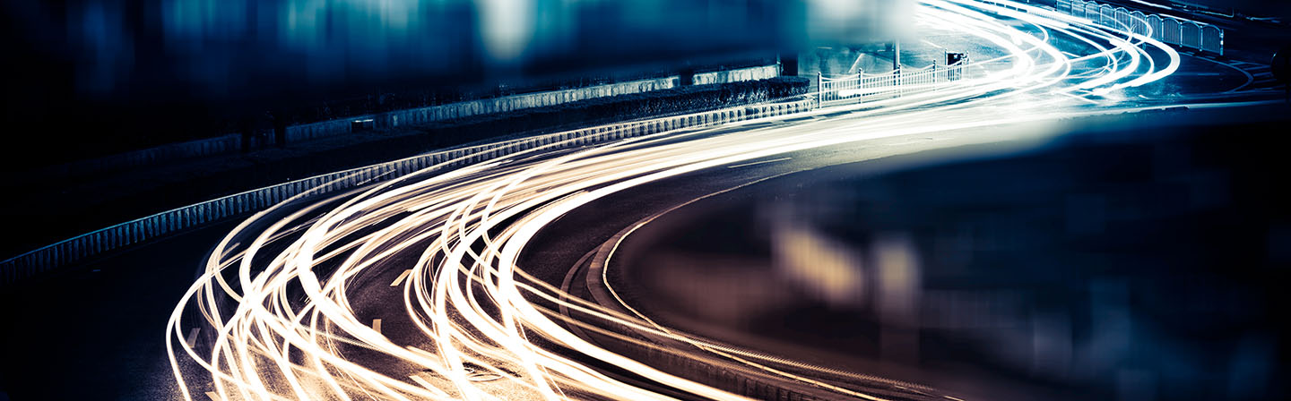 Superimposed light trails on a road